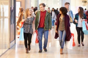 Group of young friends shopping at the mall