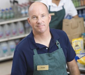 Supermarket employee and check out assistant