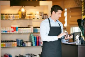 Portrait Of Male Sales Assistant In Beauty Product Shop