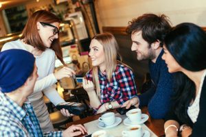 Beautiful Waitress Charging Customers Bill With A Credit Card Terminal