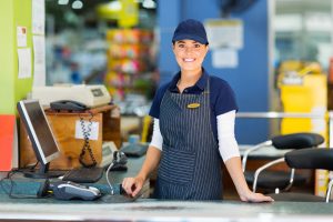 beautiful woman working as a cashier at the supermarket