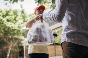 Delivery man bringing food